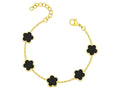 Gold bracelet with black clover-shaped charms on a white background