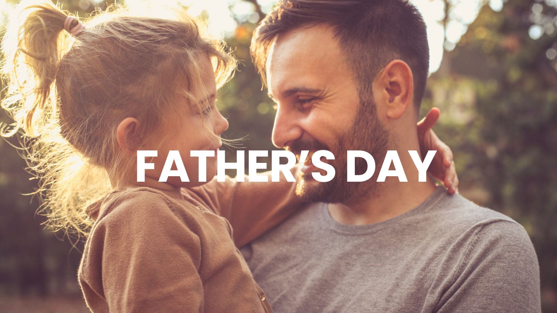 Man and child embracing with 'Father's Day' text overlay