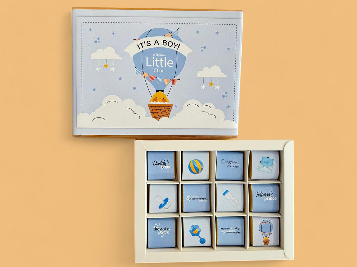 newborn baby boy chocolate gift, baby boy chocolate box Dubai, it’s a boy gift box UAE, newborn congratulations chocolate UAE, baby shower gift boy chocolate, welcome baby boy chocolate box, premium milk chocolate baby boy gift Dubai